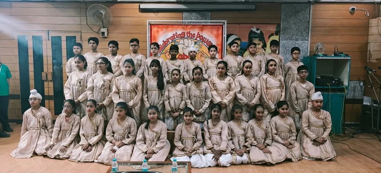 Happy children in colorful fancy dress costumes